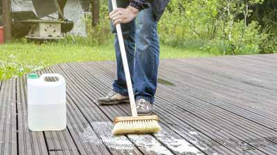 scrubbing brush on cedar wood